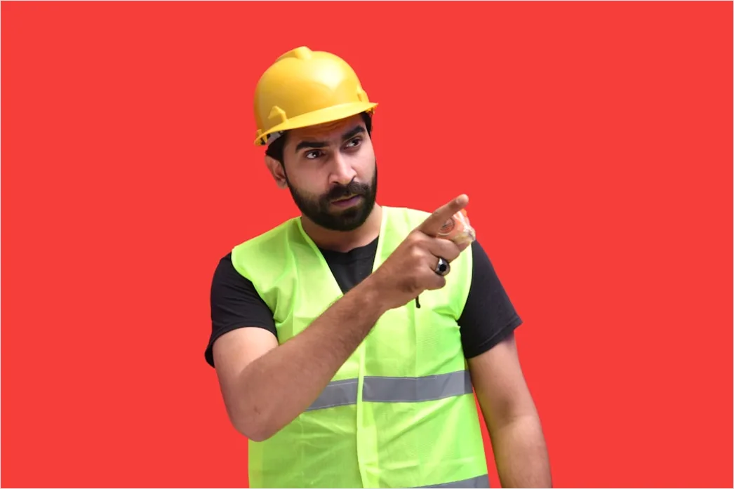 Detail Worker Wearing Hard Hat And High Vis Vest Number 16