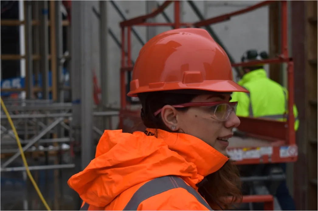 Detail Worker Wearing Hard Hat And High Vis Vest Number 19