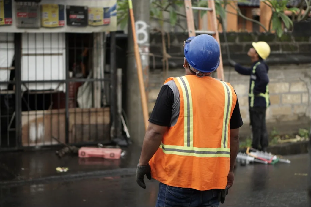 Detail Worker Wearing Hard Hat And High Vis Vest Number 9