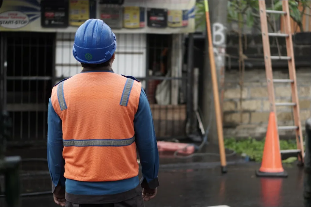 Detail Worker Wearing Hard Hat And High Vis Vest Number 10