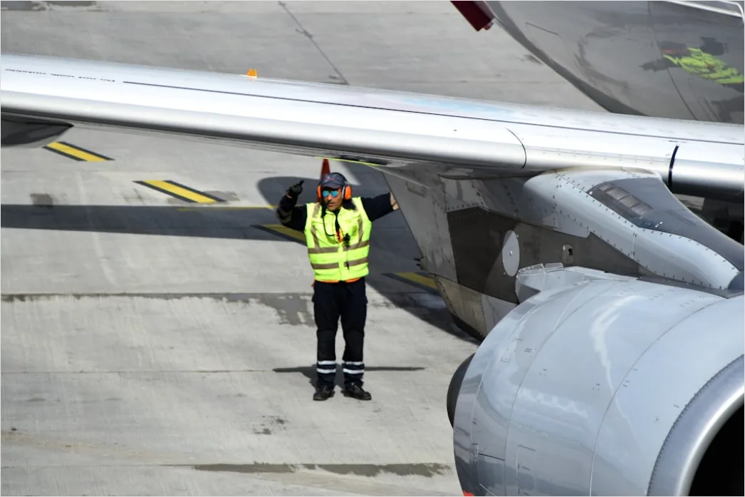 Detail Aircraft Maintenance Engineer Inspecting Engine Number 13