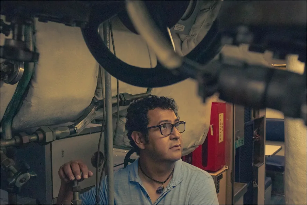 Detail Aircraft Maintenance Engineer Inspecting Engine Number 6