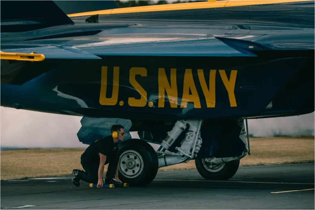 Detail Aircraft Maintenance Engineer Inspecting Engine Number 10