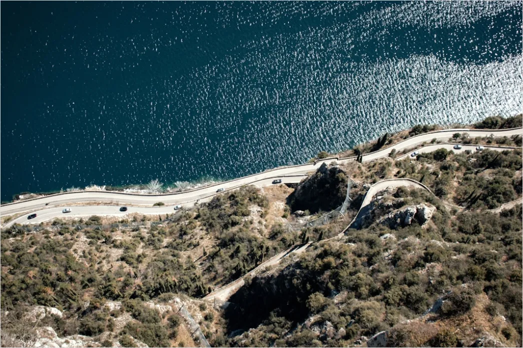 Detail Biker Riding On Coastal Road Aerial View Number 16