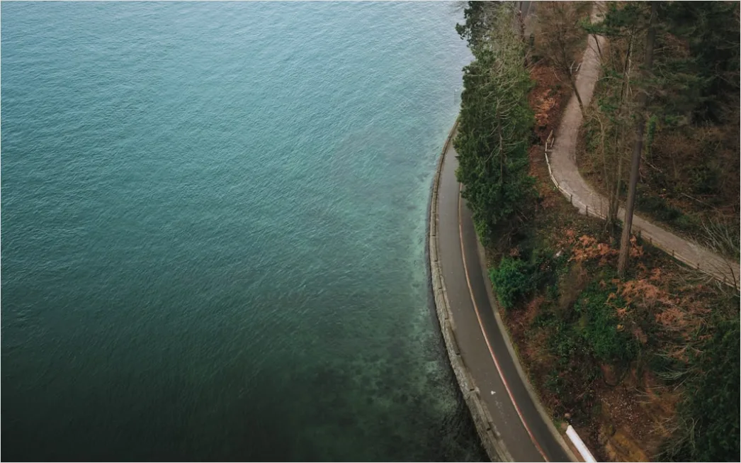 Detail Biker Riding On Coastal Road Aerial View Number 3