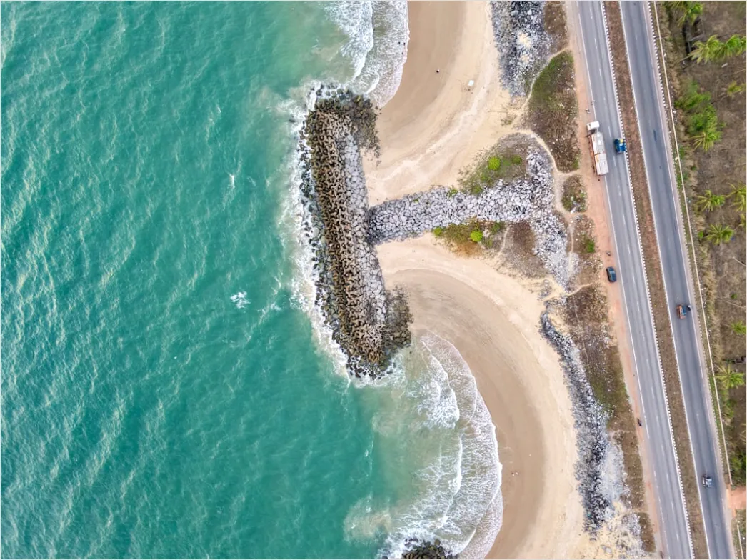 Detail Biker Riding On Coastal Road Aerial View Number 10