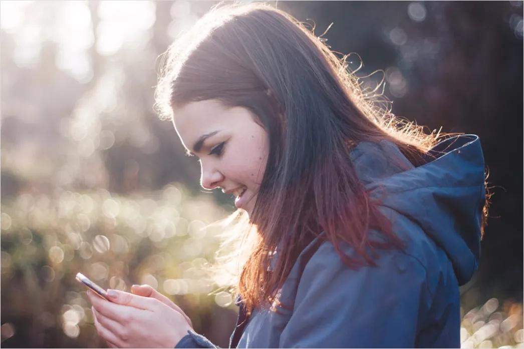 Candid Portrait Teenager Using Smartphone Outdoor 0f5e