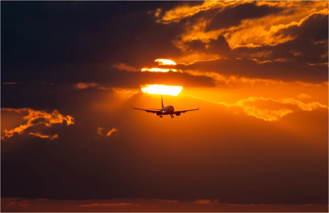 Detail Commercial Airplane Taking Off At Sunset Number 3