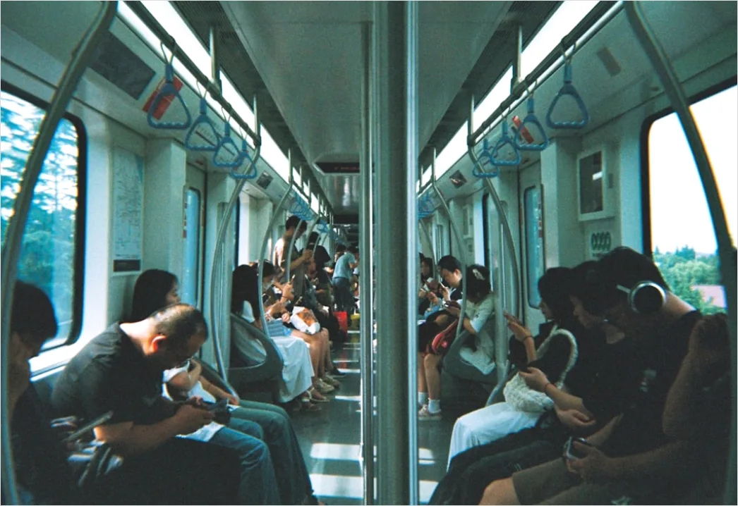 Detail Commuters On Subway Train Reading Phones Number 13