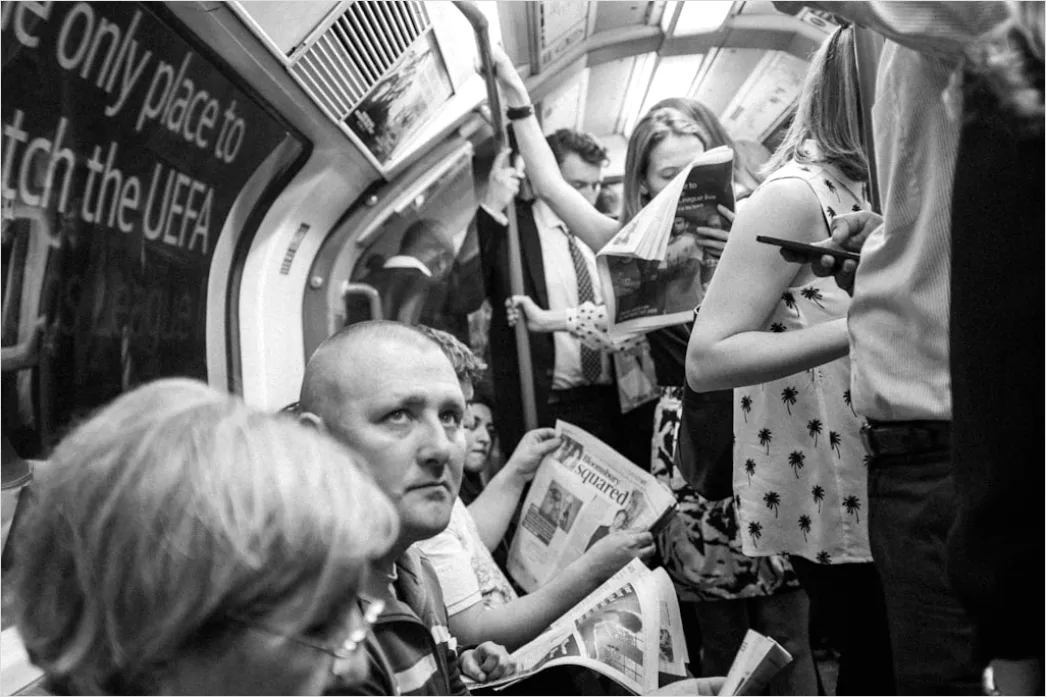 Detail Commuters On Subway Train Reading Phones Number 14