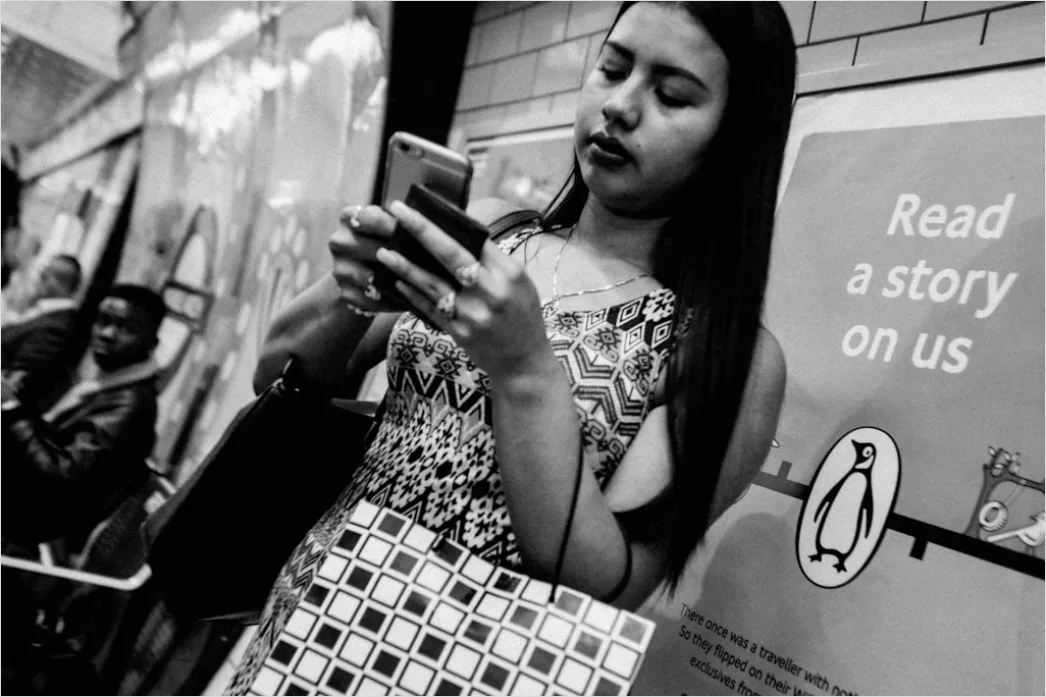 Detail Commuters On Subway Train Reading Phones Number 15