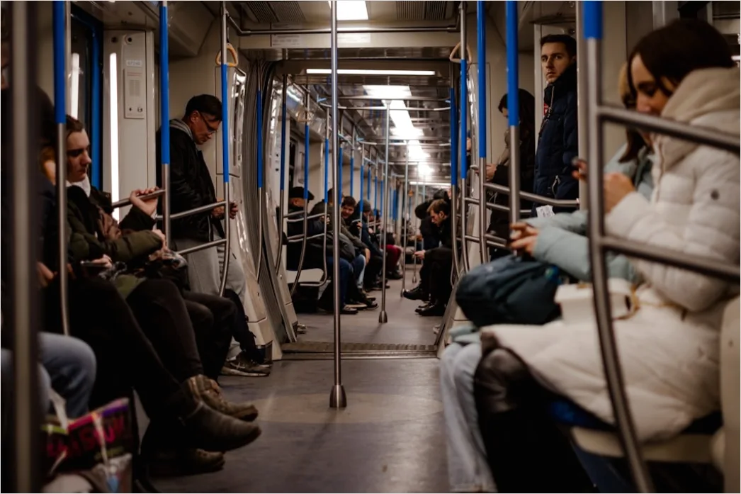 Detail Commuters On Subway Train Reading Phones Number 3