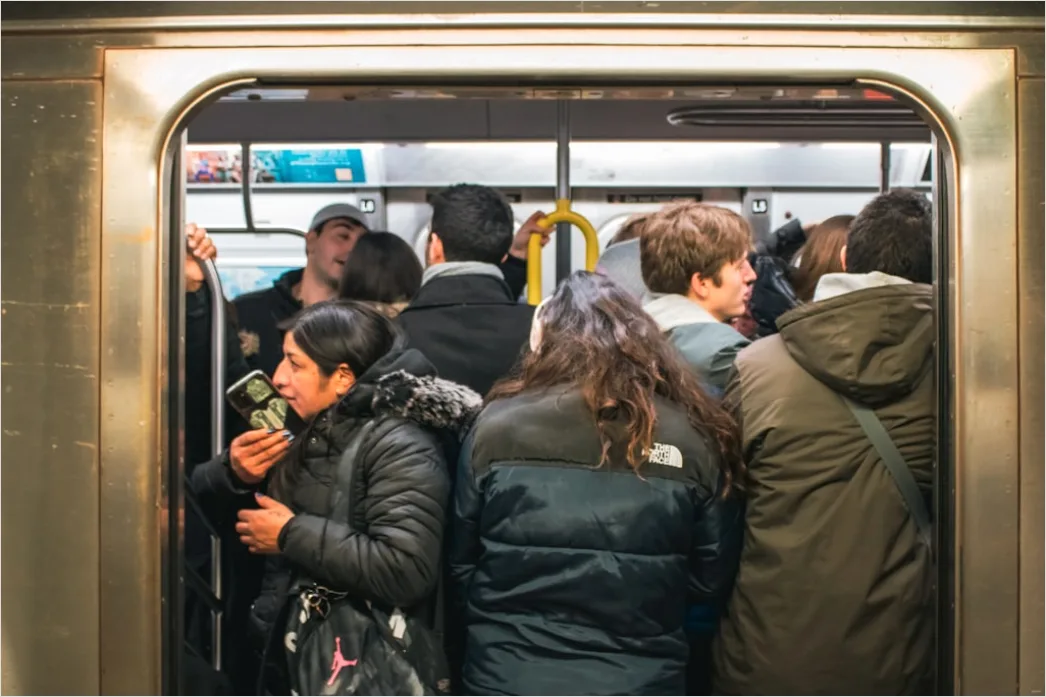 Detail Commuters On Subway Train Reading Phones Number 8