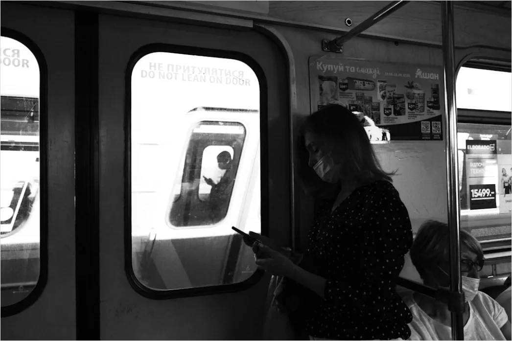 Detail Commuters On Subway Train Reading Phones Number 9