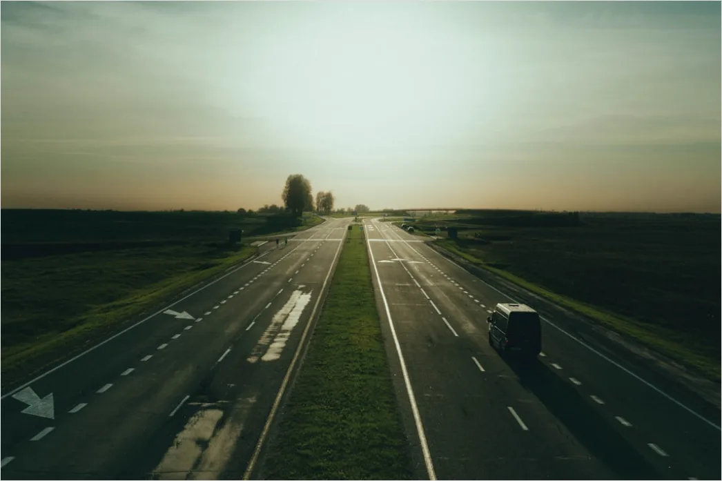 Detail Motorcycle On Open Highway Sunset Landscape Number 17