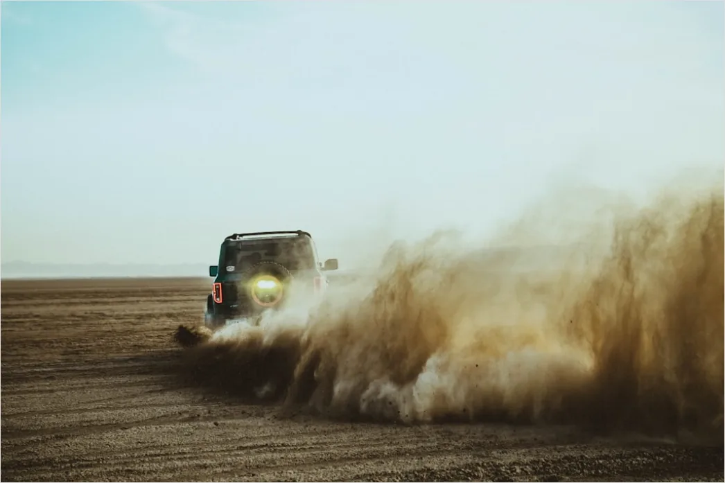 Detail Off Road Vehicle Dust Cloud Action Shot Number 3