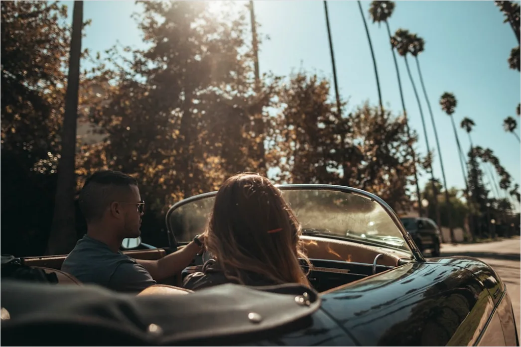 Detail Road Trip Couple Driving Convertible Sunset Number 3