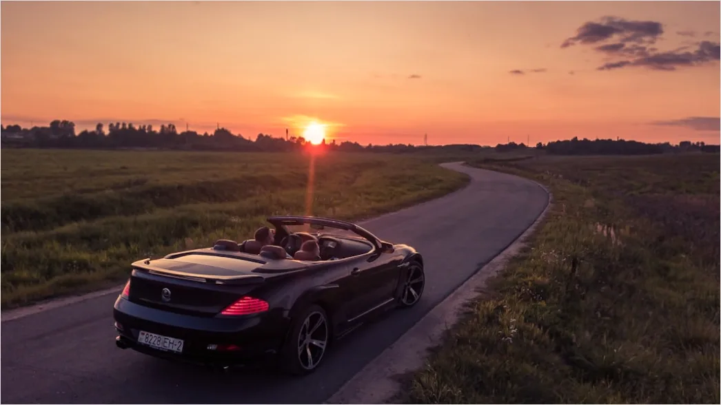 Detail Road Trip Couple Driving Convertible Sunset Number 4
