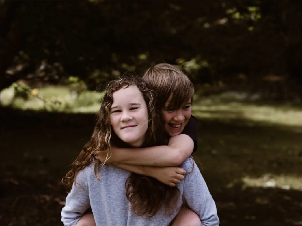 Siblings Portrait Playing Together Outdoor Candid 9875