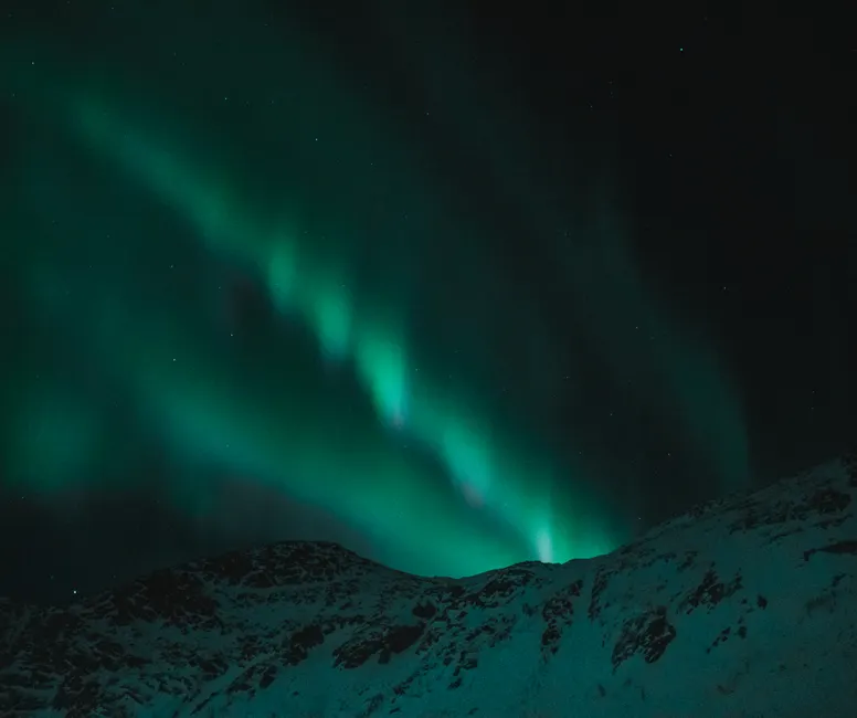 Detail Aurora Over Snowy Mountains Number 2
