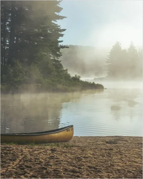 Detail Canoe On Lake Mist Photo Number 6