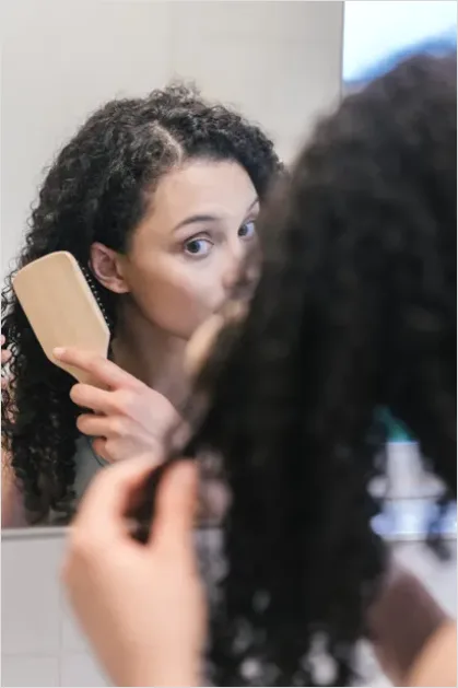 Detail Woman Brushing Hair Photo Number 3