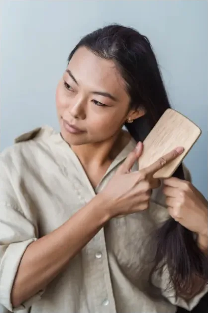 Detail Woman Brushing Hair Photo Number 4