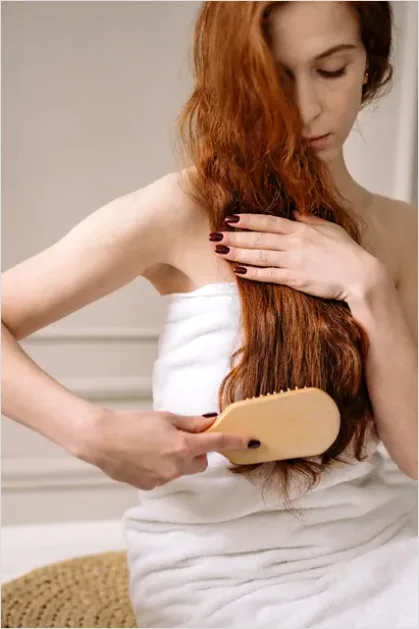 Detail Woman Brushing Hair Photo Number 8