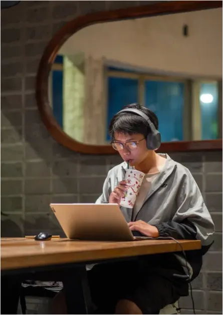 Detail Student Wearing Headphones Studying Photo Number 9