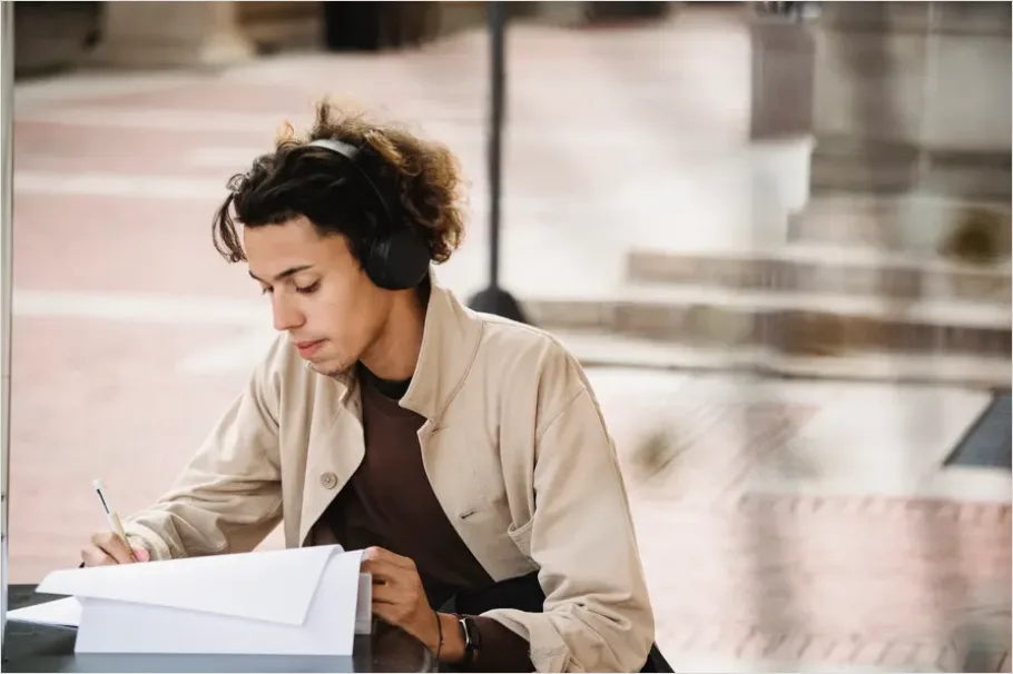 Detail Student Wearing Headphones Studying Photo Number 10