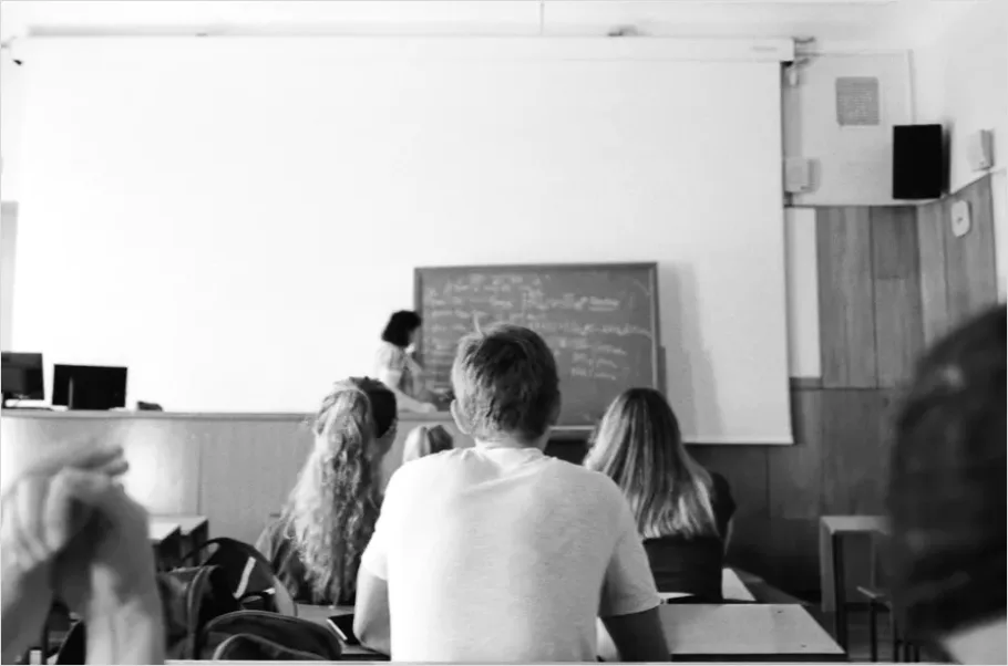 Detail Teacher Teaching In Classroom Photo Number 2
