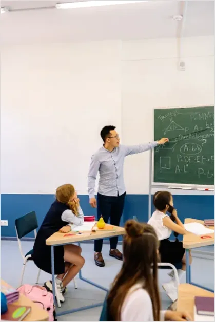 Detail Teacher Teaching In Classroom Photo Number 12