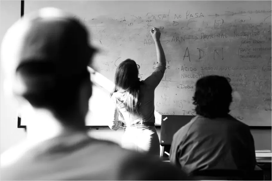 Detail Teacher Teaching In Classroom Photo Number 7