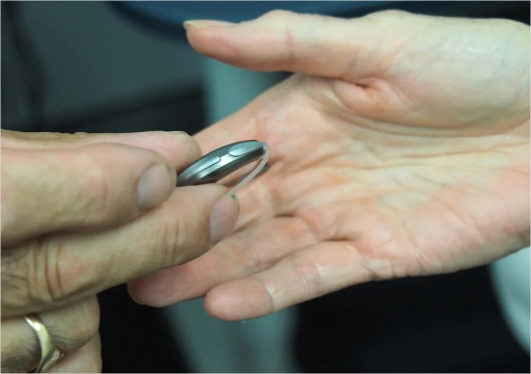 Detail Hearing Aids In Hand Close Up Number 13
