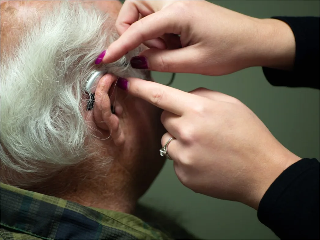 Detail Hearing Aids In Hand Close Up Number 3