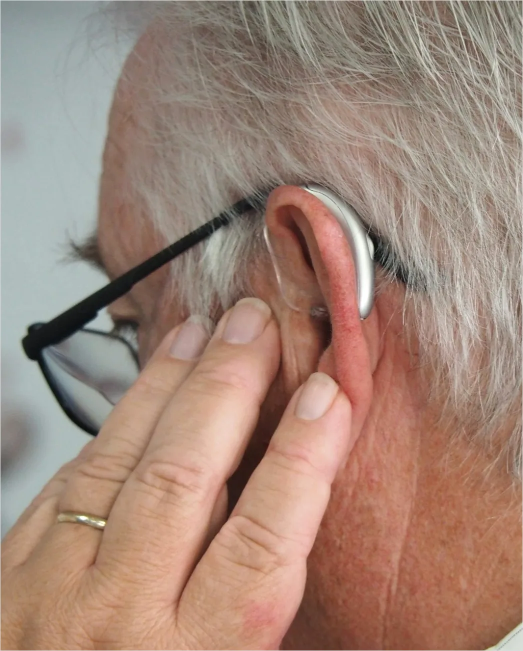 Detail Hearing Aids In Hand Close Up Number 6