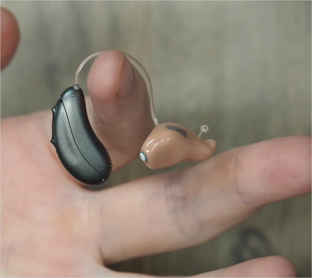 Detail Hearing Aids In Hand Close Up Number 7