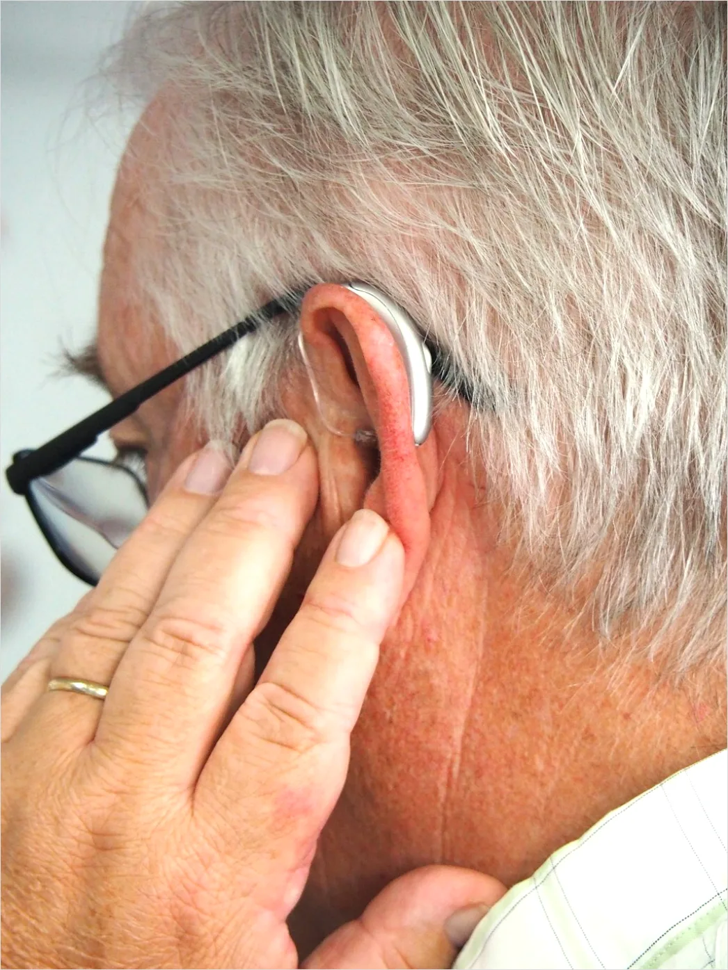 Detail Hearing Aids In Hand Close Up Number 9