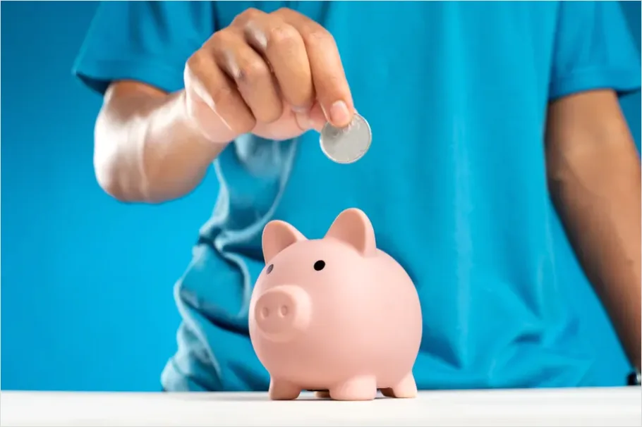 Detail Piggy Bank And Coins On Table Photo Number 12