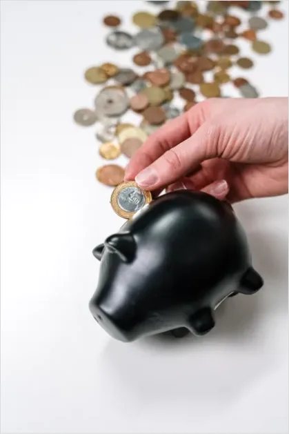 Detail Piggy Bank And Coins On Table Photo Number 3