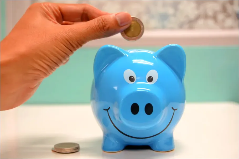 Detail Piggy Bank And Coins On Table Photo Number 5