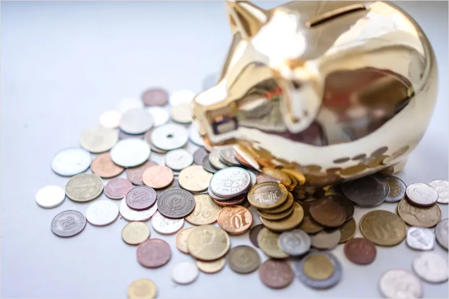 Detail Piggy Bank And Coins On Table Photo Number 6