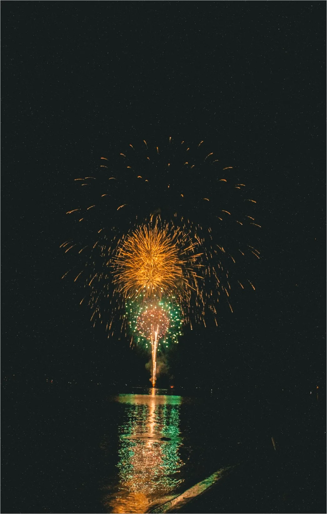 Detail Fireworks Reflection On Water Long Exposure Number 6