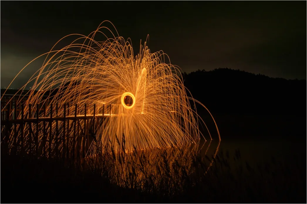Detail Fireworks Reflection On Water Long Exposure Number 10