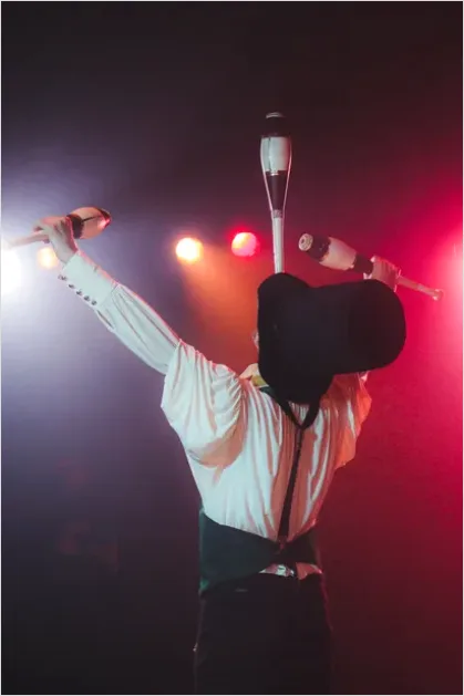 Detail Juggler Performing Under Spotlight Photo Number 2