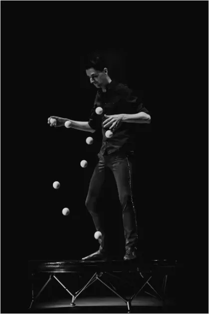 Detail Juggler Performing Under Spotlight Photo Number 7