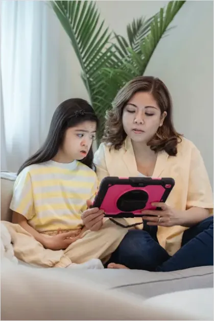 Detail Assistive Communication Device Kid Using Tablet Number 2