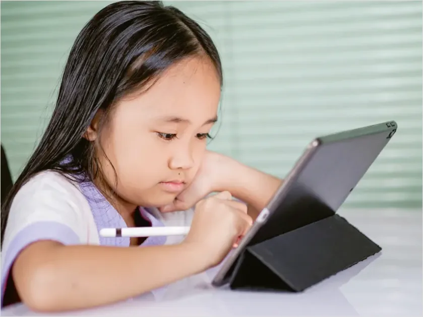 Detail Assistive Communication Device Kid Using Tablet Number 3