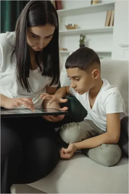 Detail Assistive Communication Device Kid Using Tablet Number 4