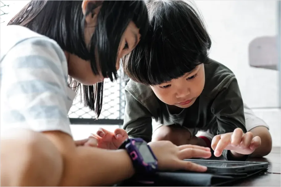 Detail Assistive Communication Device Kid Using Tablet Number 9